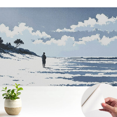 Tapéta magányos alakgal a strandon kék háttérrel