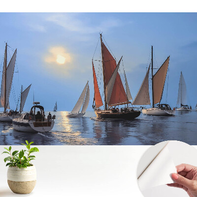 Tapéta jachtokkal és naplementével a nyugodt tengeren