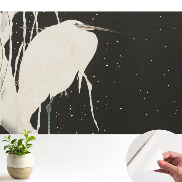 Tapéta Egy madár egy ágon egy téli estén