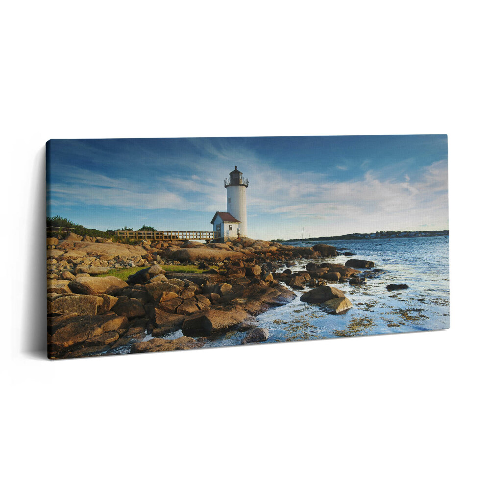 Vászonfotó 100x50 Tájkép világítótorony sziklákkal és égbolt