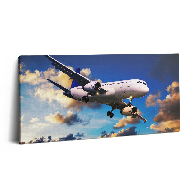 Vászonfotó 100x50 Repülőgép a felhők között