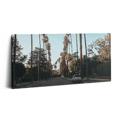 Vászonfotó 100x50 Jármű az úton a fák között