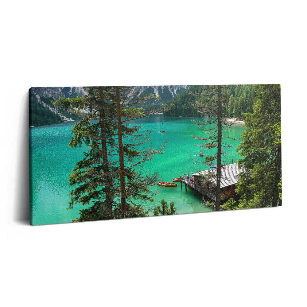 Vászonfotó 100x50 Fából készült kenu a vízben