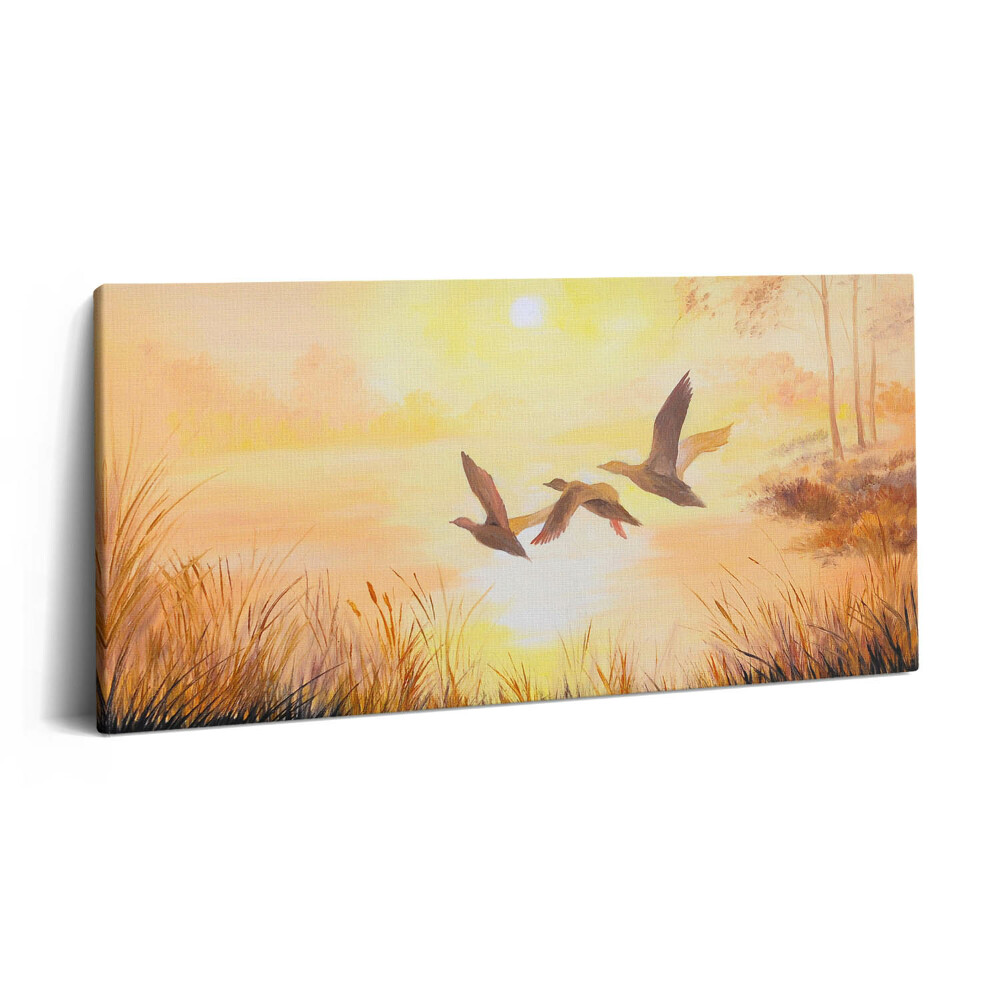 Vászonkép nyomtatás 120x60 Daruk naplementében