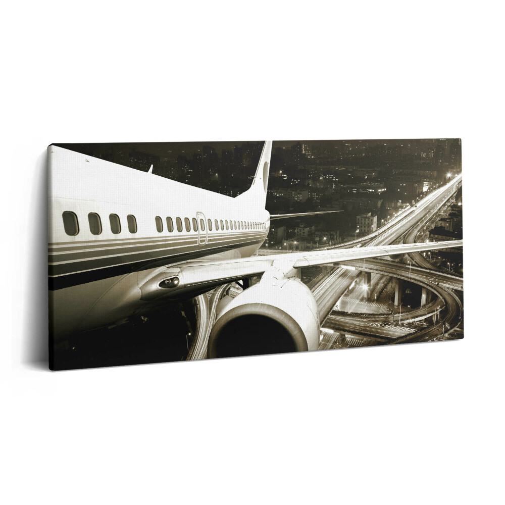 Vászonkép nyomtatás 120x60 Repülőgép és város