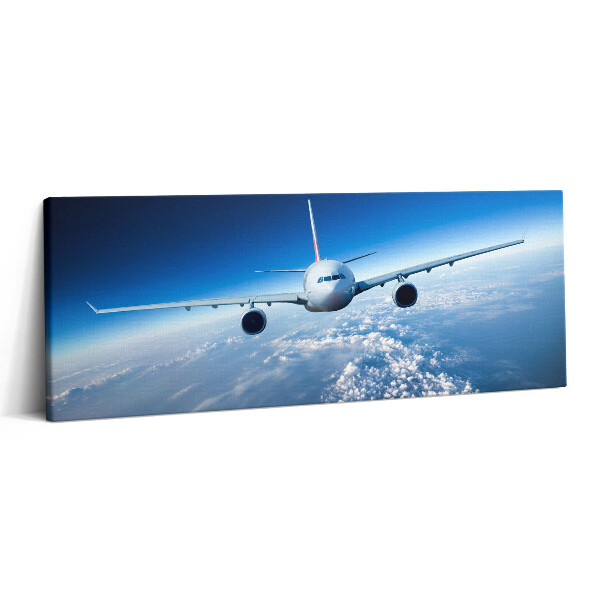Canvas kép 125x50 Repülőgép a felhők felett