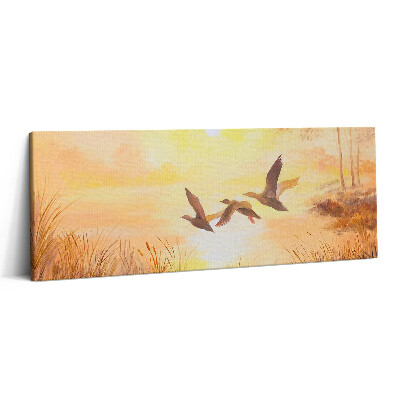 Canvas kép 125x50 Daruk naplementében