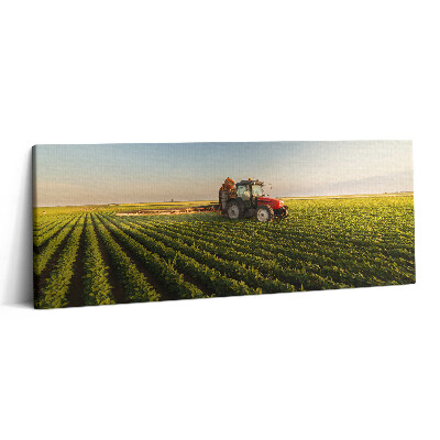 Canvas kép 125x50 Traktor permetez egy mezőn