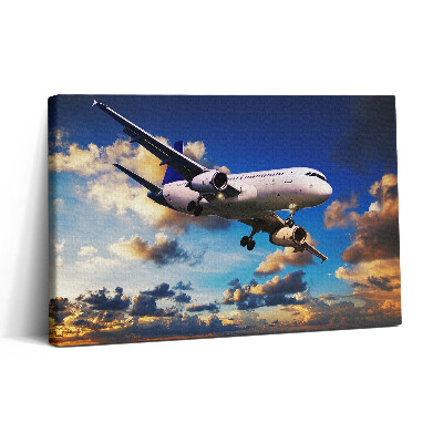 Vászonkép nyomtatás 30x20 Repülőgép a felhők között