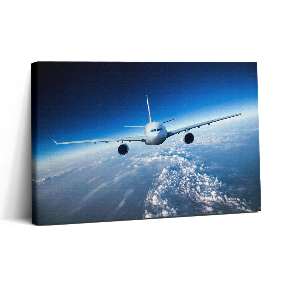 Vászonkép nyomtatás 30x20 Repülőgép a felhők felett