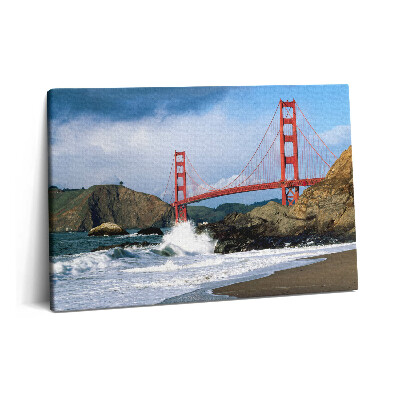 Canvas kép 60x40 Hullámok a tengerparton és egy piros híd
