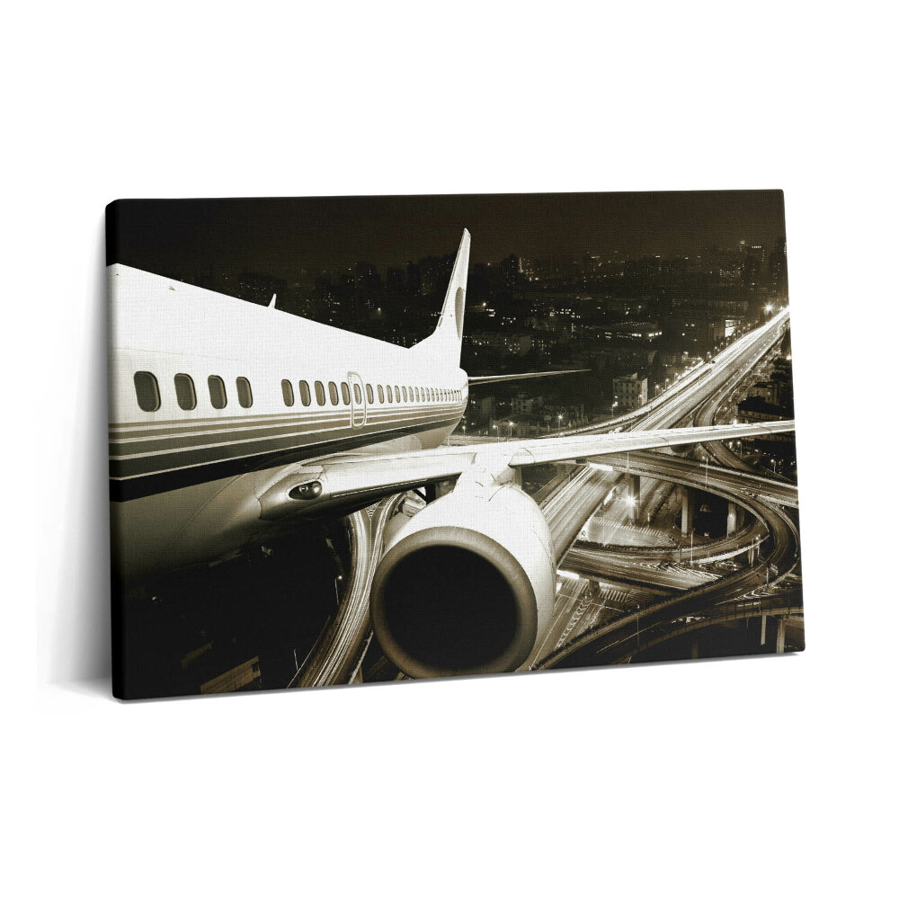 Canvas kép 60x40 Repülőgép és város