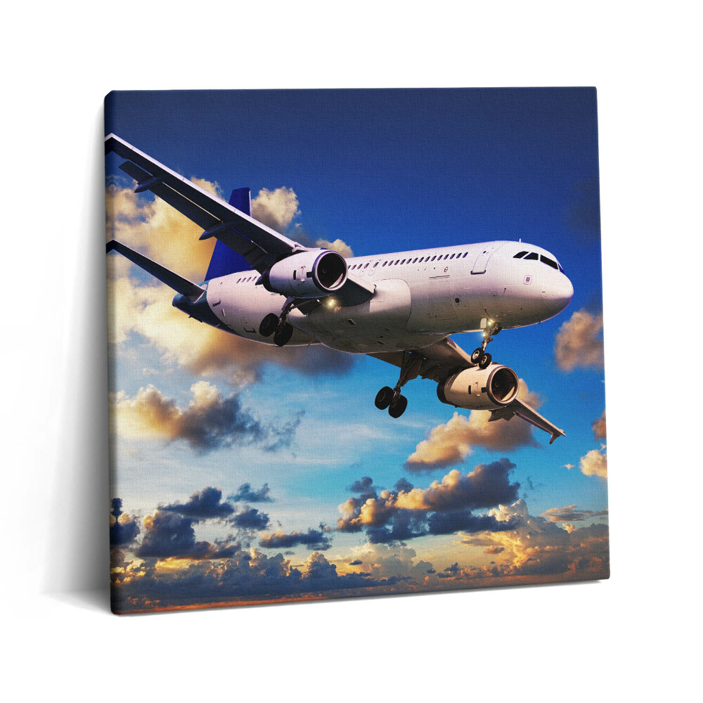 Vászonkép 60x60 Repülőgép a felhők között