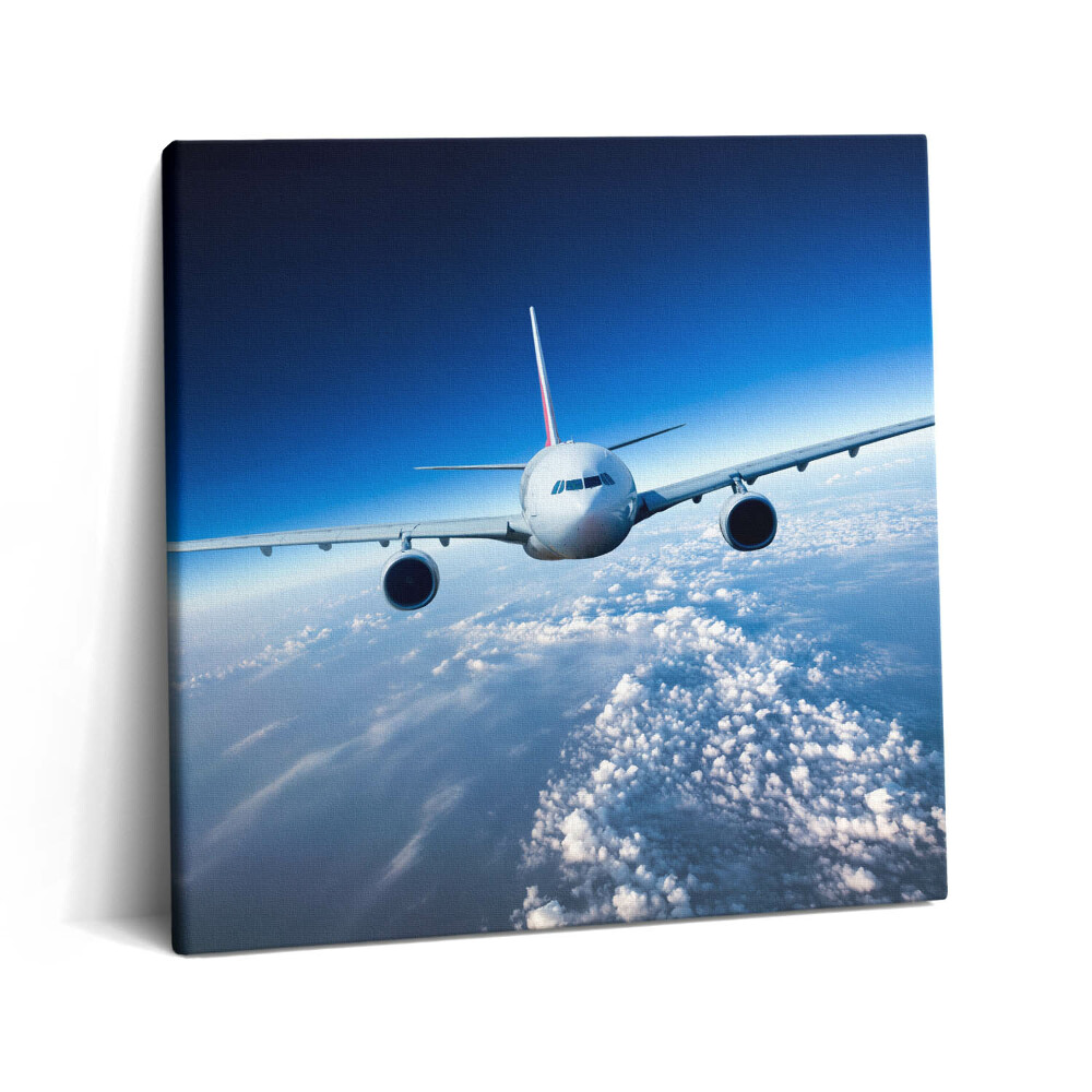 Vászonkép 60x60 Repülőgép a felhők felett