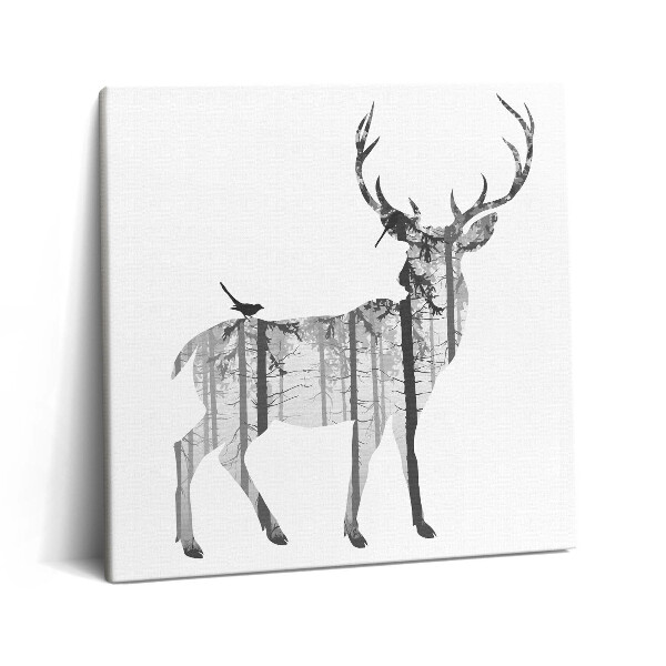 Vászonkép 60x60 Egy szarvas és egy erdő sziluettje