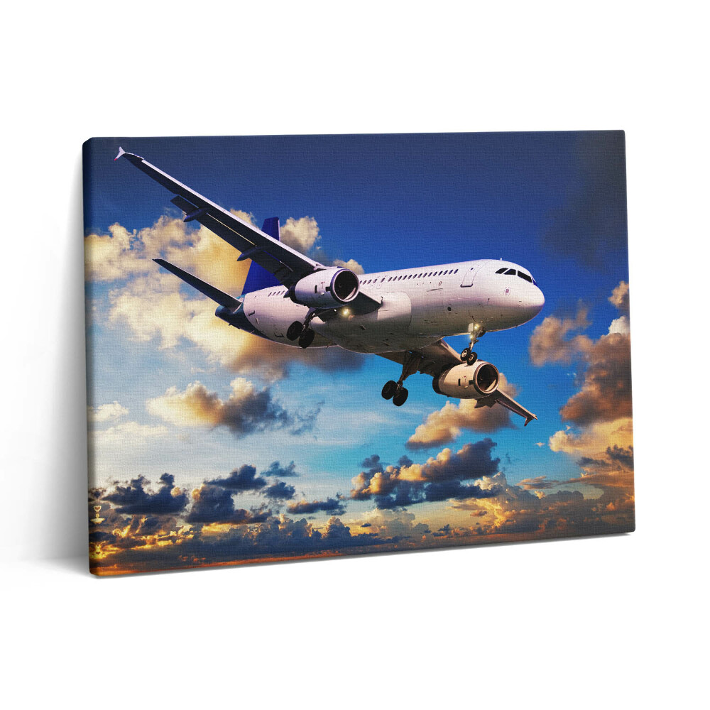 Vászonkép falra 80x60 Repülőgép a felhők között