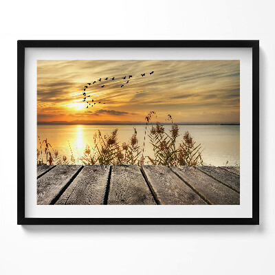 Kép keretben Naplemente vízparton madarak repülnek