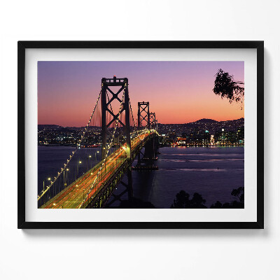 Kép keretben Híd városnézettel naplementében