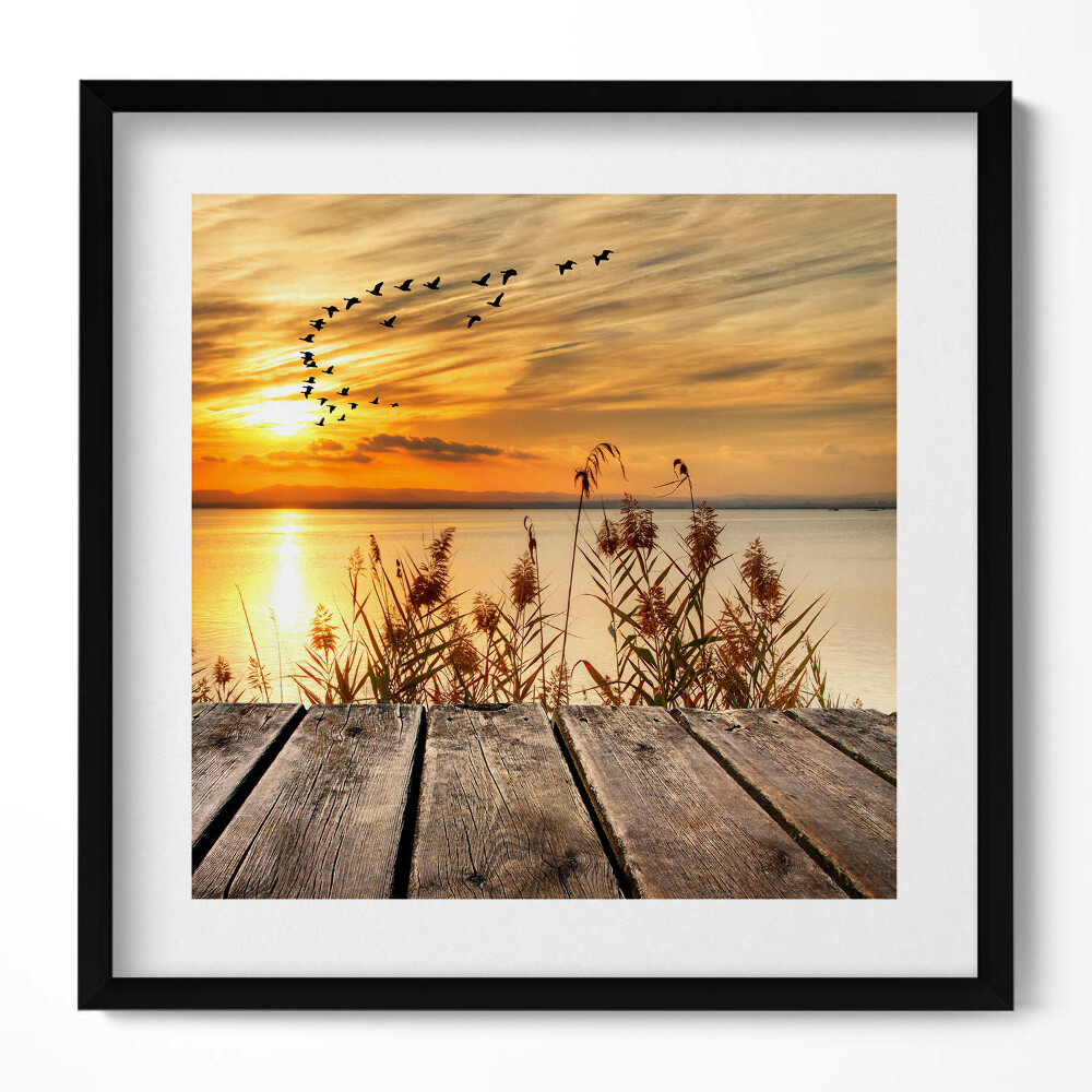 Keretezett falikép Naplemente vízparton madarak repülnek