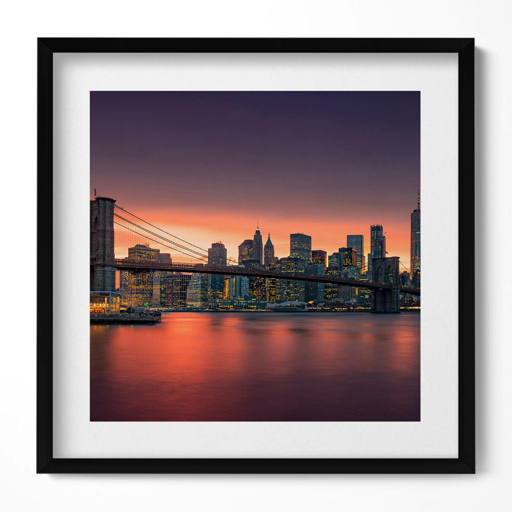 Keretezett falikép Híd és város skyline naplementében