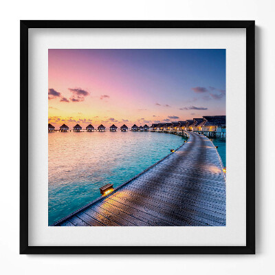 Keretezett falikép Tengerparti naplemente vízparti házak