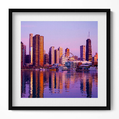 Keretezett falikép Városi táj naplementében