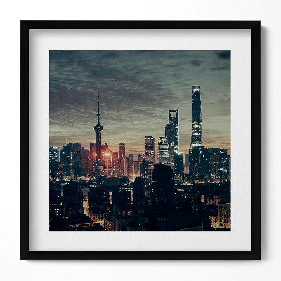 Keretezett falikép Modern városkép naplementében