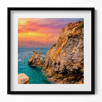 Keretezett falikép Tengerparti szikla naplementében