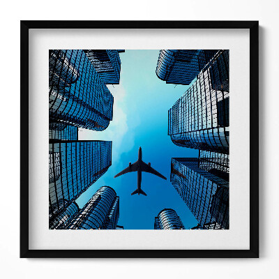 Keretezett falikép Repülőgép városi felhőkarcolók között