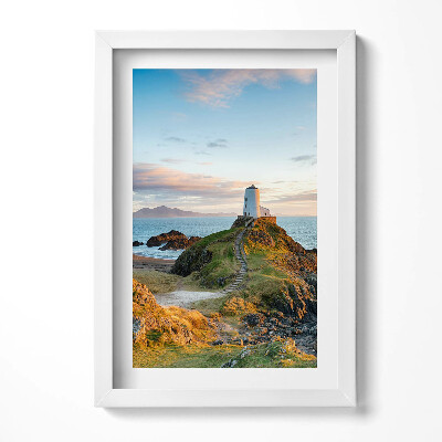 Keretezett kép Világítótorony sziklán naplementében