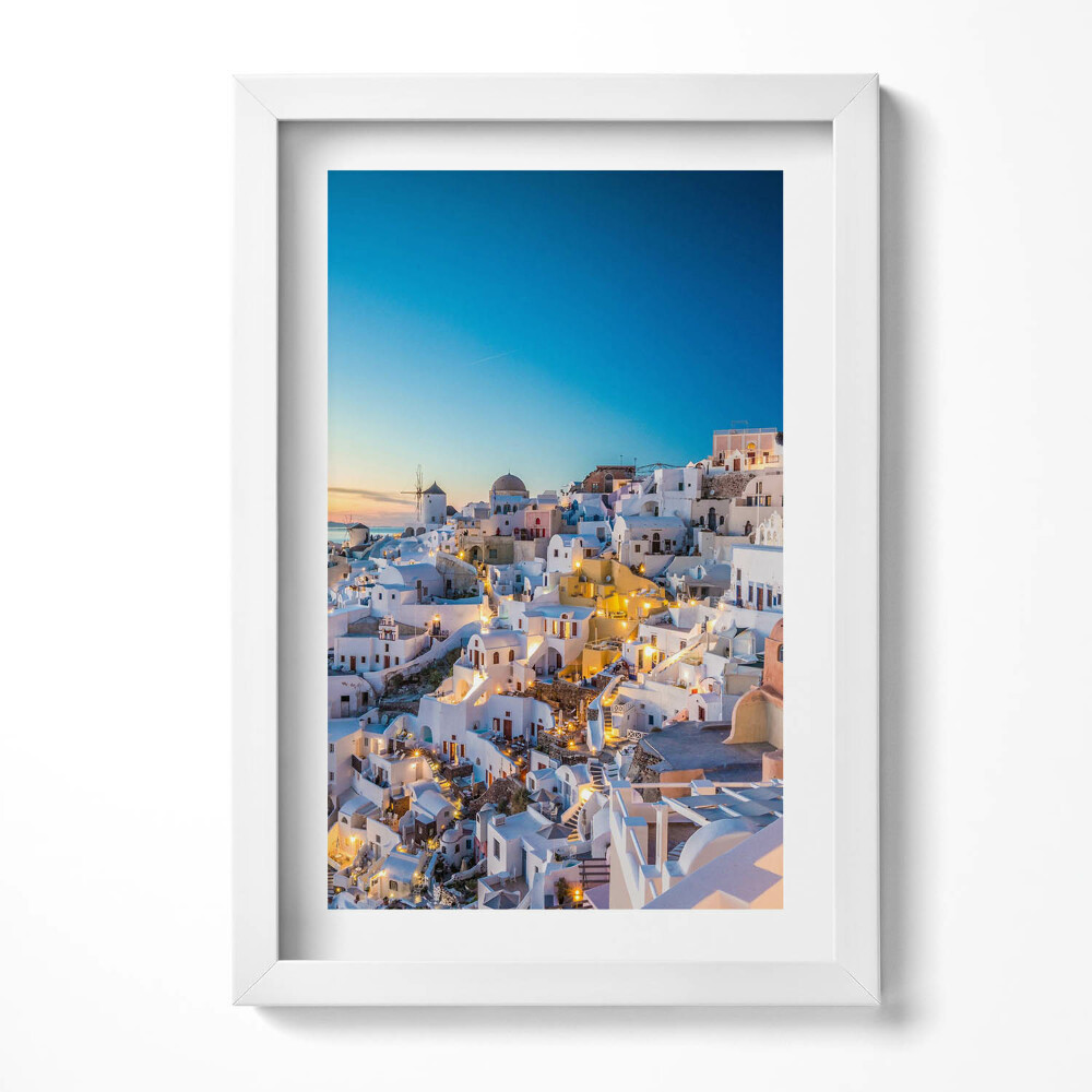 Keretezett kép Fehér házak kék kupolák naplemente