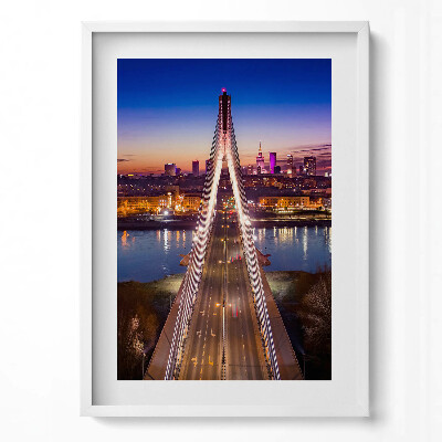 Függőleges kép keretben Híd városi tájjal és naplementével