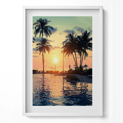 Függőleges kép keretben Naplemente pálmafákkal és vízparttal