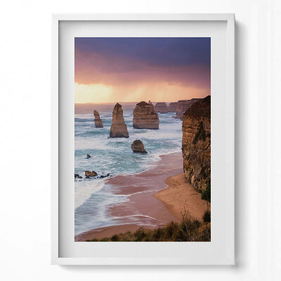 Függőleges kép keretben Tengerparti sziklaformációk naplementében