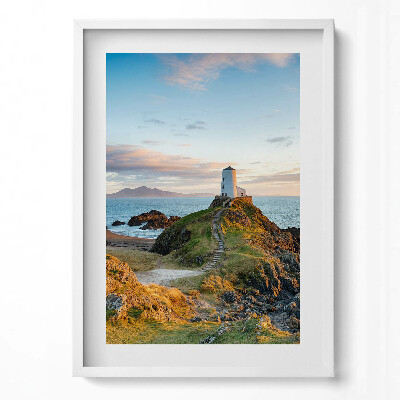 Függőleges kép keretben Világítótorony sziklán naplementében