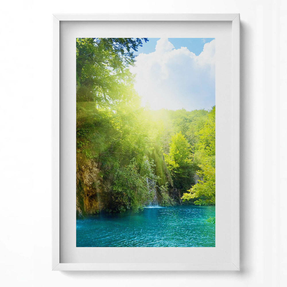 Függőleges kép keretben Zöld dombok vízesés kék tó