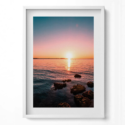 Függőleges kép keretben Naplemente a víz felett