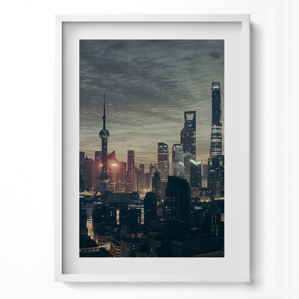 Függőleges kép keretben Modern városkép naplementében