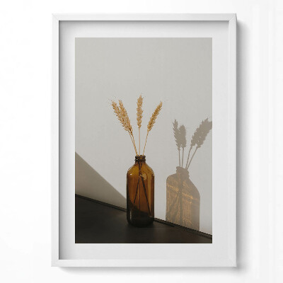 Függőleges kép keretben Barna üveg vázában búzavirágok