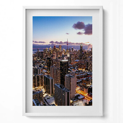 Függőleges kép keretben Városi táj naplementében