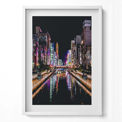 Függőleges kép keretben Fényes városi táj éjszaka