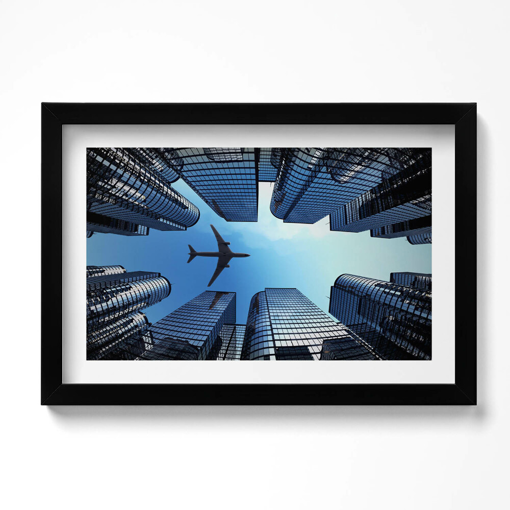 Keretezett kép Repülőgép épületek felett