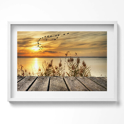 Kép keretben Naplemente vízparton madarak repülnek
