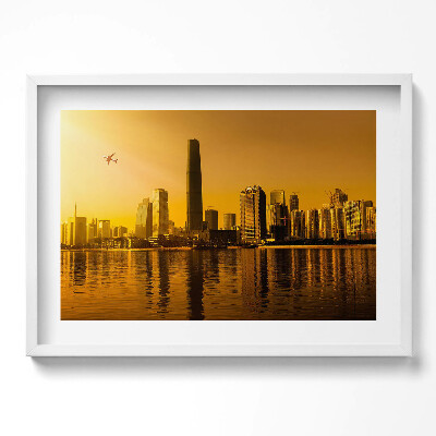 Kép keretben Modern városkép naplementében
