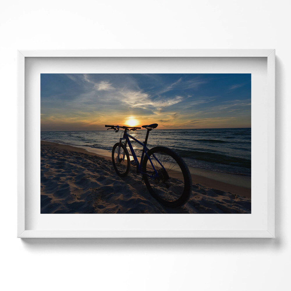 Kép keretben Naplemente kerékpárral a tengerparton
